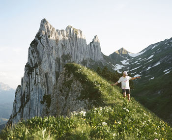 Rear view of man walking on mountain