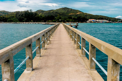 Pier over sea against sky