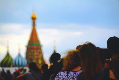 People in temple against sky