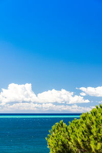 Scenic view of sea against blue sky