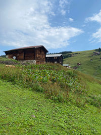 House on field against sky