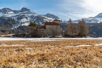 Switzerland, february 21, 2023 historic old castle crap da sass at the lake of silvaplana 