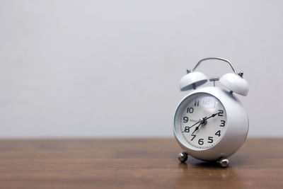 Close-up of clock on table