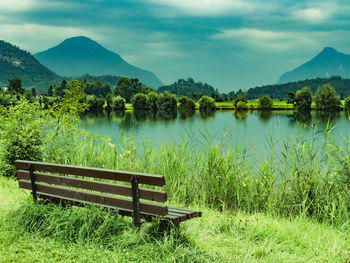 Scenic view of lake and mountains against sky