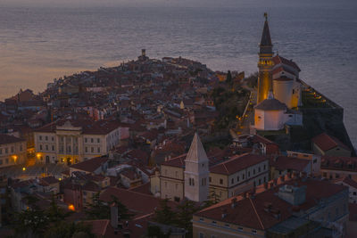 Aerial view of city lit up at night