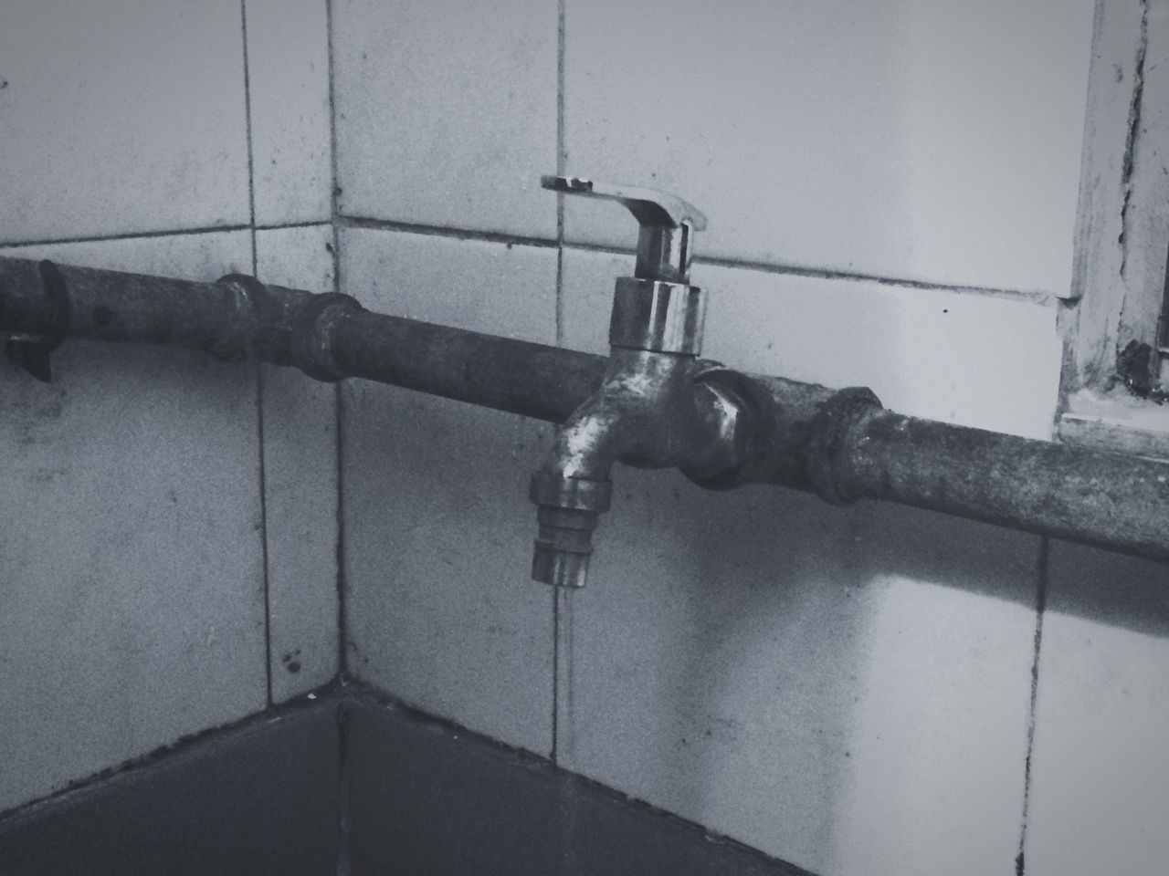 indoors, wall - building feature, metal, built structure, faucet, lighting equipment, close-up, wall, architecture, bathroom, old, electricity, hanging, no people, metallic, pipe - tube, protection, technology, door, handle