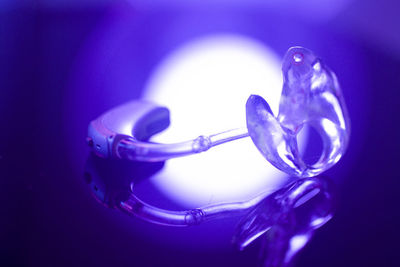 Close-up of glass against blue background