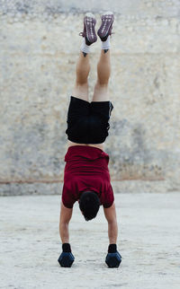 Man standing upright during a crossfit training routine.