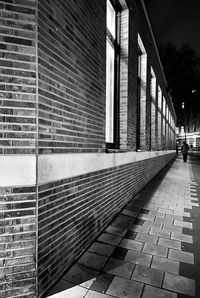 Footpath amidst buildings in city