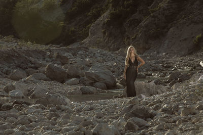 Woman standing on rock