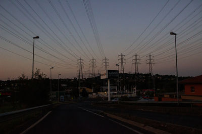 Street against sky during sunset