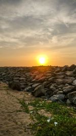 Scenic view of sunset over land