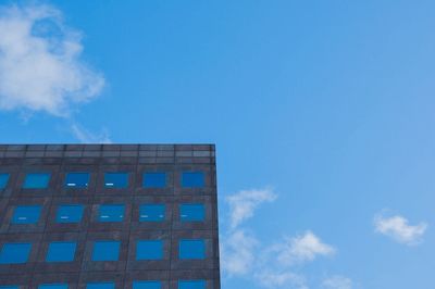 Low angle view of building against blue sky