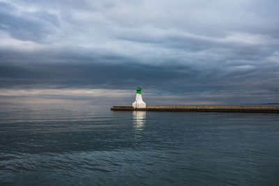 Statue of lighthouse at seaside