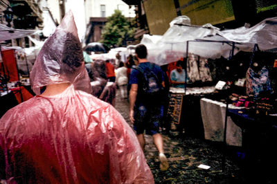 Rear view of people in market