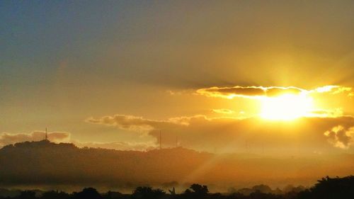 Sun shining through clouds