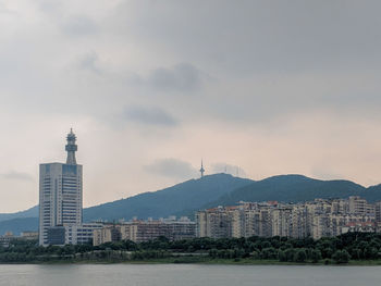 Buildings in city against sky