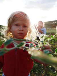 Close-up of cute girl on field