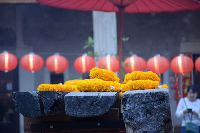 Close-up of illuminated candles at market stall