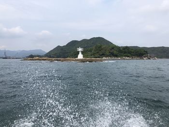 View of sea with mountain in background