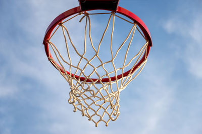 Low angle view of basketball hoop against sky