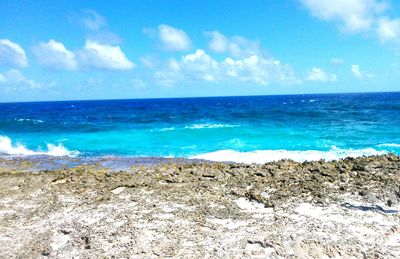 Scenic view of sea against cloudy sky