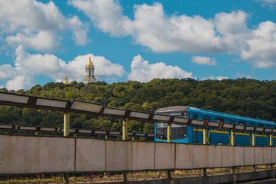 Train on railroad track against sky