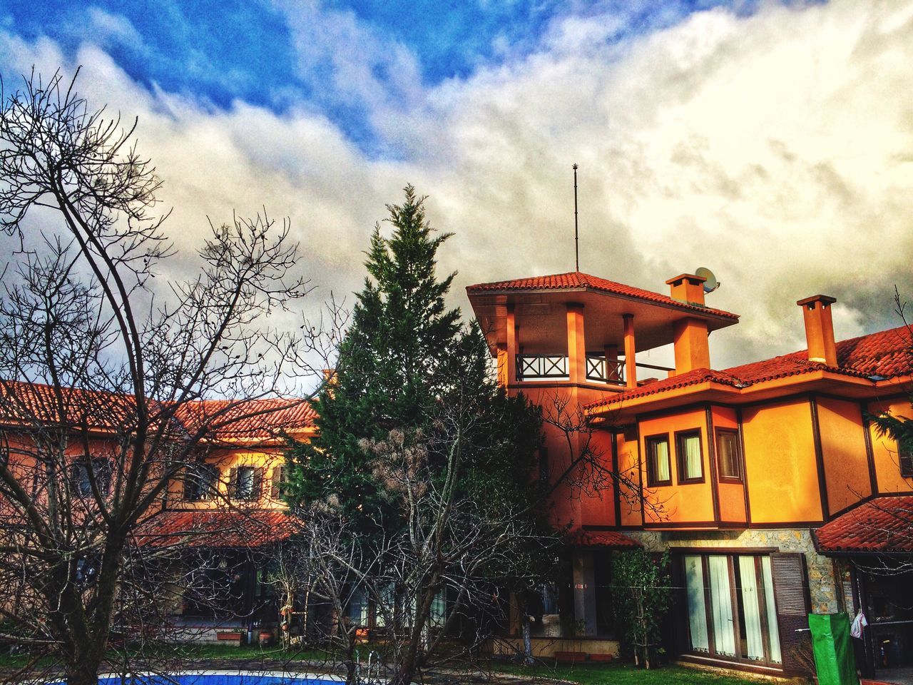 architecture, building exterior, built structure, sky, tree, cloud - sky, house, cloudy, low angle view, residential structure, residential building, bare tree, cloud, outdoors, weather, dusk, no people, nature, building, overcast