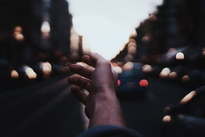 Close-up of hand on road