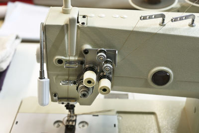 Industrial sewing machine. textile factory sewing workshop.