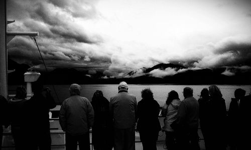 Silhouette of people standing in water