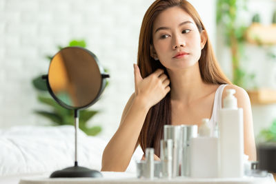 Portrait of a young woman looking away