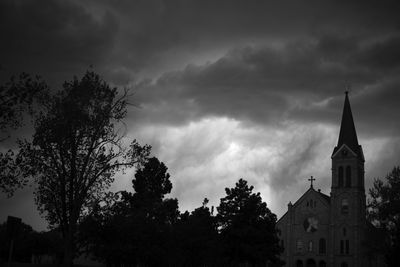 Low angle view of bell tower against sky