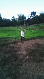 Man standing on grassy field