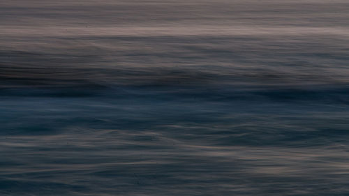 Scenic view of sea against sky at sunset