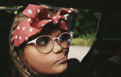 Portrait of girl in car