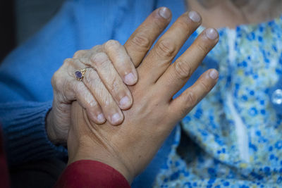 Close-up of woman hand with blue eyes