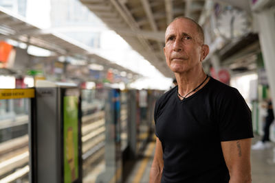 Portrait of man standing outdoors