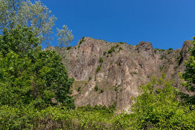 Scenic view of rocky mountains against clear blue sky