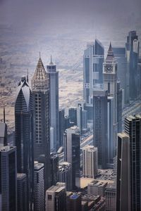 Buildings in city against sky