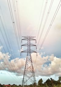 Low angle view of electricity pylon against sky