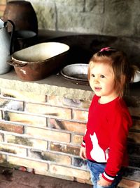 Portrait of a girl sitting on table