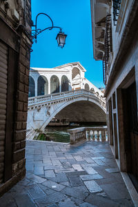 Street amidst buildings in city against sky