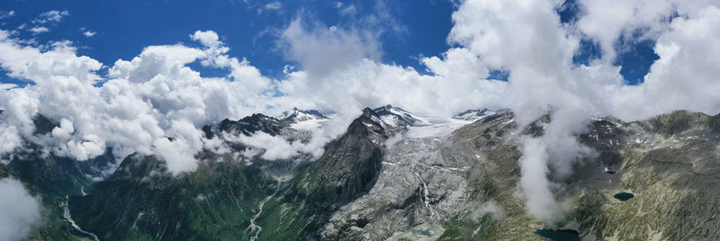 Panoramic view of snowcapped mountains against sky