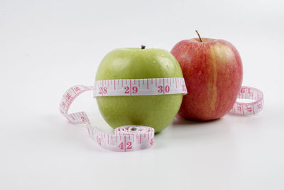 Close-up of apple against white background