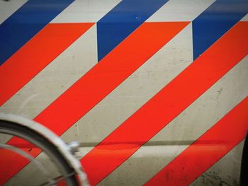 Red and blue stripes on police car