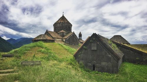 Low angle view of haghpat monastery against cloudy sky