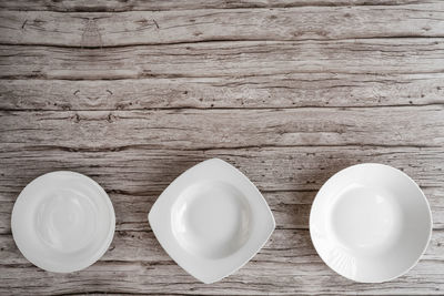 High angle view of empty coffee cups on table