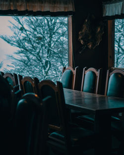 Empty chairs and table in restaurant