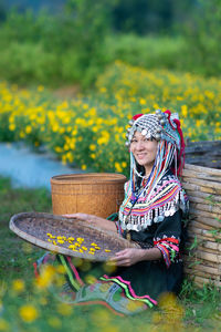 Woman with yellow flowers in basket